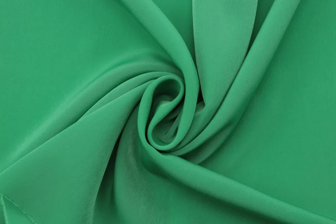 a close up view of a green fabric