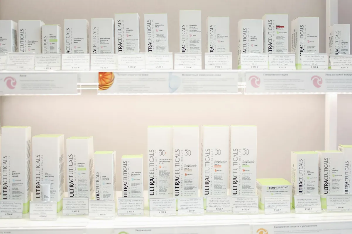 Neatly arranged Ultraceuticals skincare products on bright store shelves.
