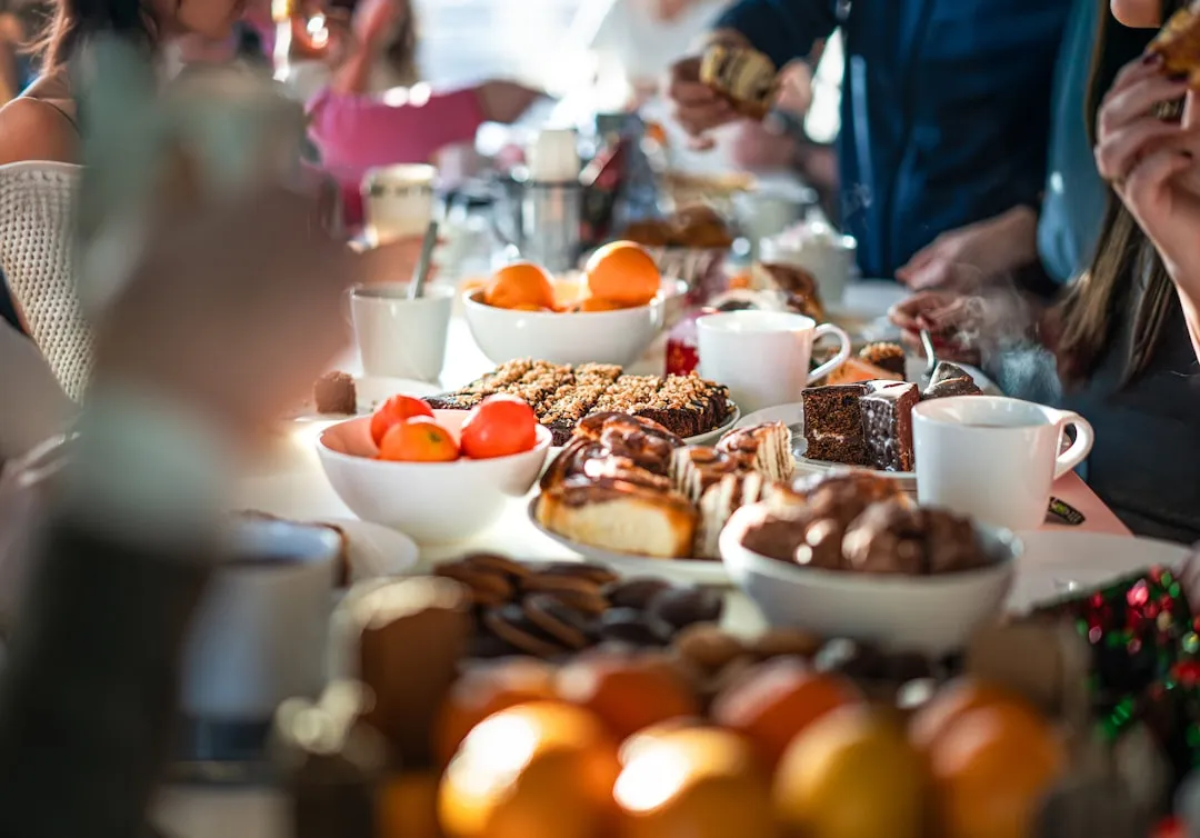 A group of people sitting at a table eating food
